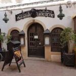 Candlelit stone vault interior of La Licorne for prestigious Medina dining Essaouira